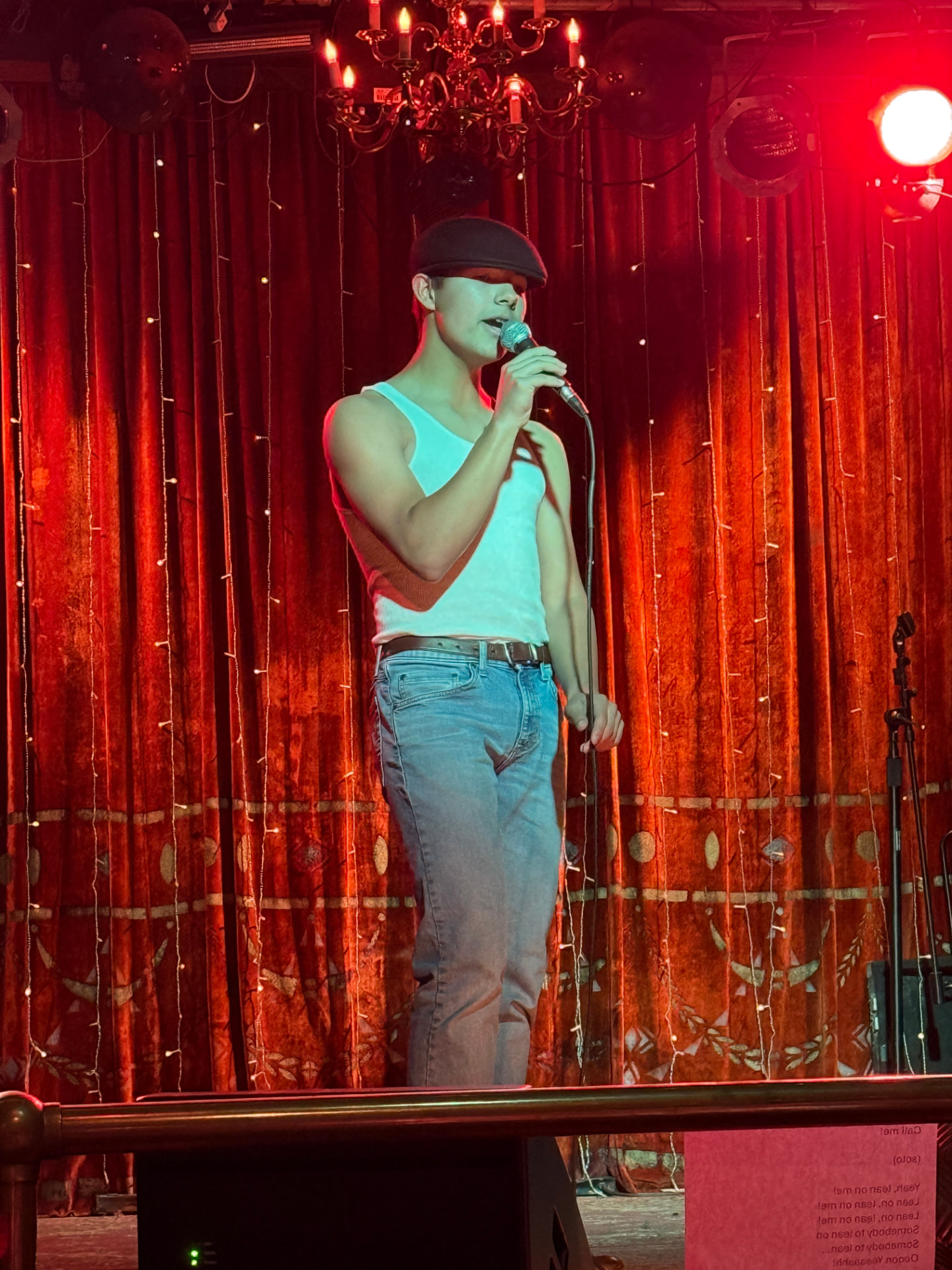 Rich Music Studios student performing on stage with a microphone